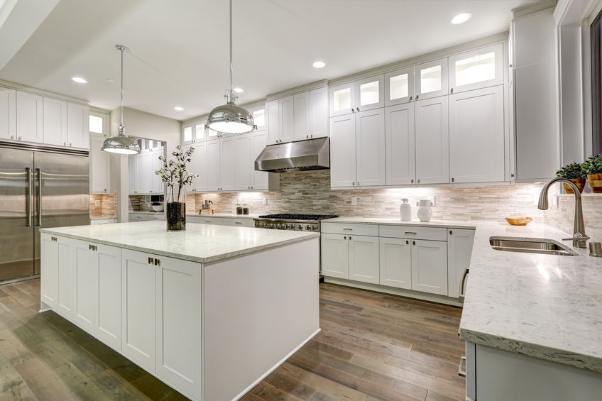 best kitchen cabinets in Orlando, Kitchen Cabinets - Design Center in Orlando, Gourmet kitchen features white shaker cabinets with marble countertops, stone subway tile backsplash, double door stainless steel refrigerator and gorgeous kitchen island. Northwest, USA